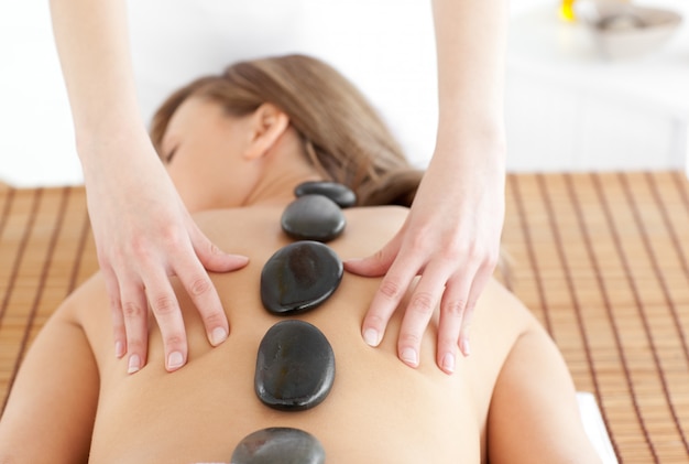 Cheerful woman lying on a massage table 