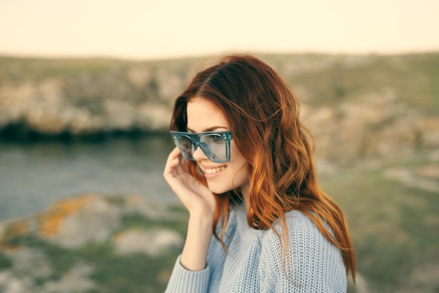 Cheerful woman outdoors landscape mountains freedom