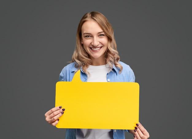 Cheerful woman with bright speech bubble