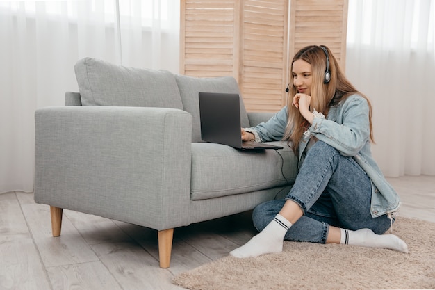 Cheerful woman working on the laptop