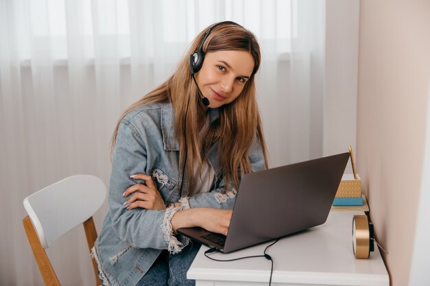 Cheerful woman working on the laptop