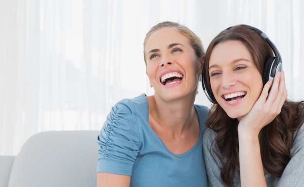 Cheerful women listening to music