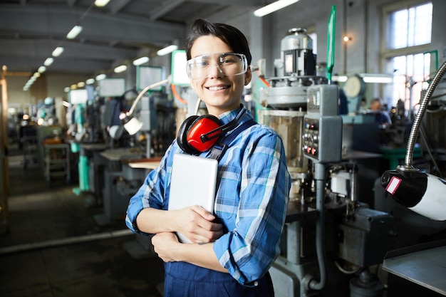 Cheerful worker of watch factory