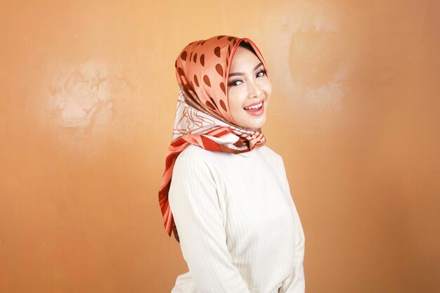 Cheerful young beautiful Asian Muslim woman smiling