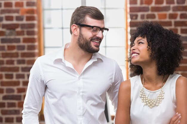 Cheerful young business people in office