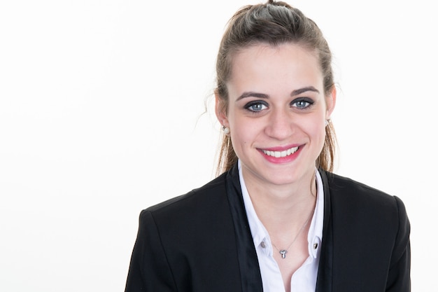 Cheerful young businesswoman standing and smiling