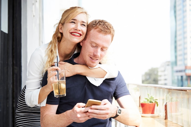 Cheerful young couple in cafe