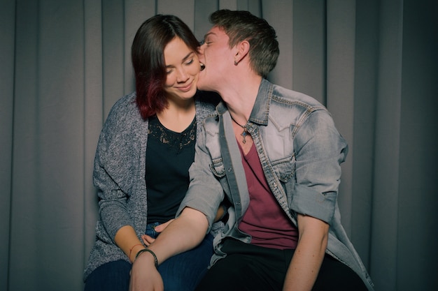 Cheerful young couple having fun and posing together