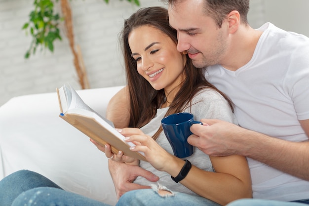 Cheerful young couple in the morning at home