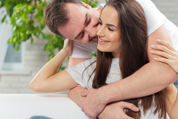 Cheerful young couple in the morning at home