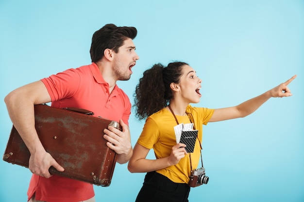 Cheerful young couple standing isolated