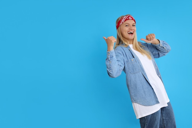 Cheerful young girl on a blue background