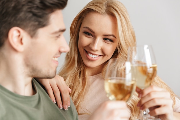 Cheerful young loving couple indoors at home