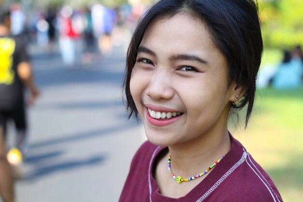 cheerful young woman asian having fun and laughing happy in summer festival