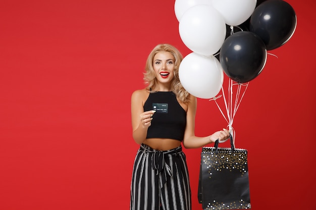 Cheerful young woman in black clothes posing 