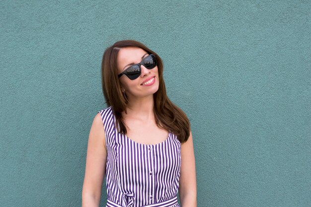 Cheerful young woman in glasses