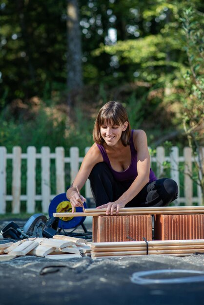 Cheerful young woman in a home diy project conceptual image