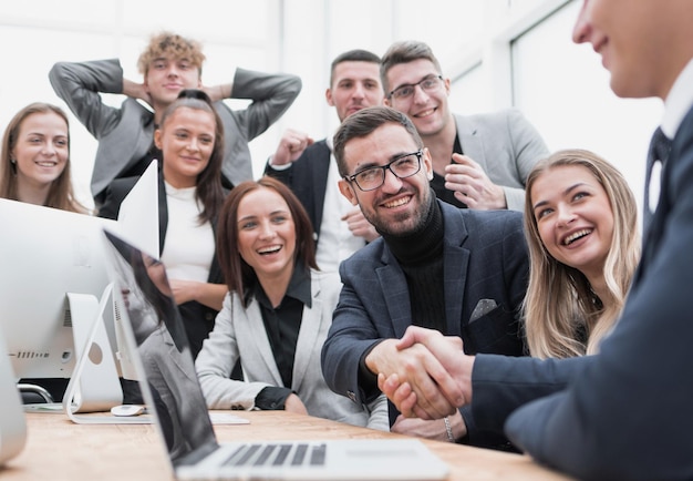 Cheering business team applauding new business partners