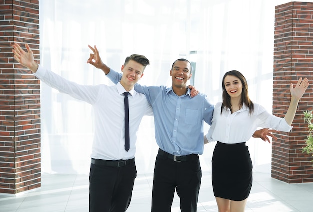 Cheering business team in the background of the office