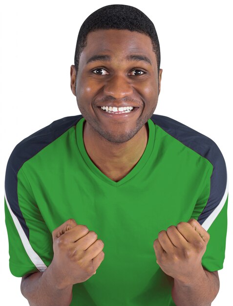 Cheering football fan in green jersey