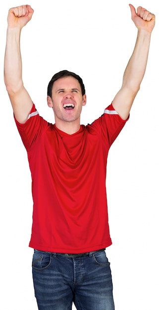 Приветствующий футбольный болельщик в красном