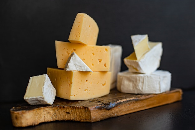 Cheese assortment of different types of hard and soft cheeses