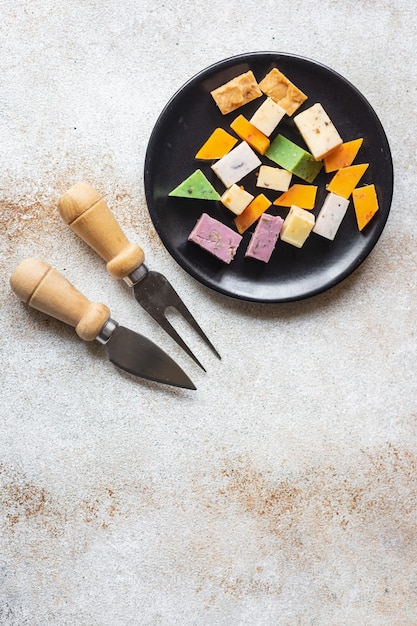 Cheese assortment variation aged cheeses basil lavender fenugreek chili baked milk turmeric carrot