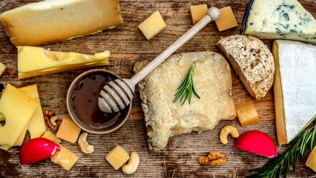 Cheese assortment on wooden board