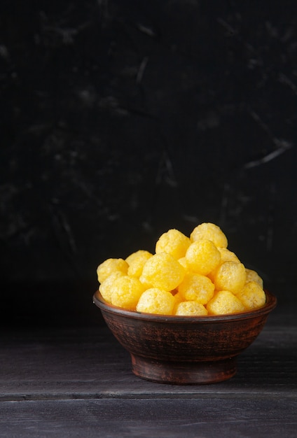 Cheese Balls on dark wooden background