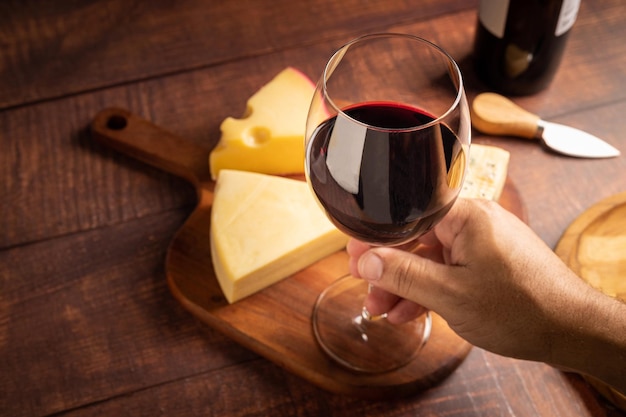 Cheese board with a glass of red wine