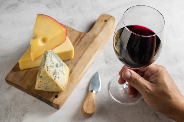 Cheese board with a glass of red wine