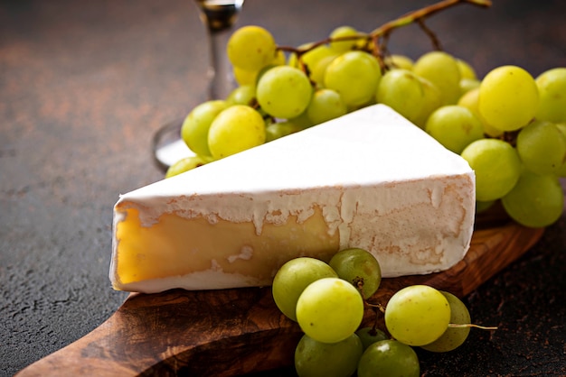 Cheese brie, grape and wine