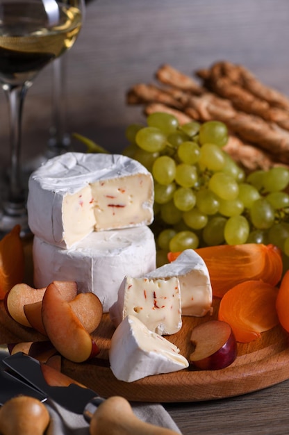 Cheese camembert with fruit and wine