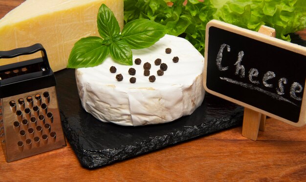 Cheese camembert on wooden board