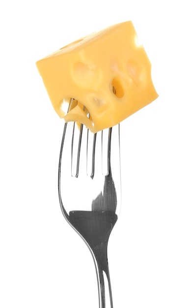 Cheese cube on fork isolated on white