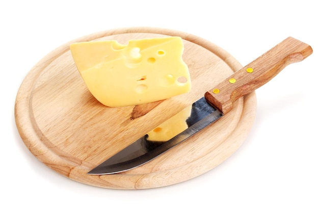 Photo cheese on cutting board with knife isolated on white