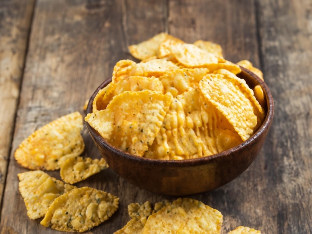 Cheese flavored corn chips in rustic bowl