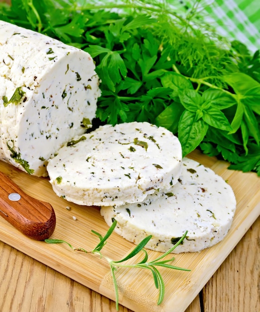 Cheese homemade with spices and napkin on board