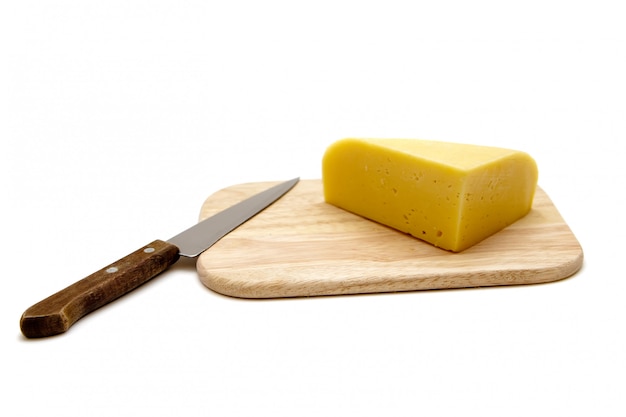 Photo cheese and knife on a cutting board