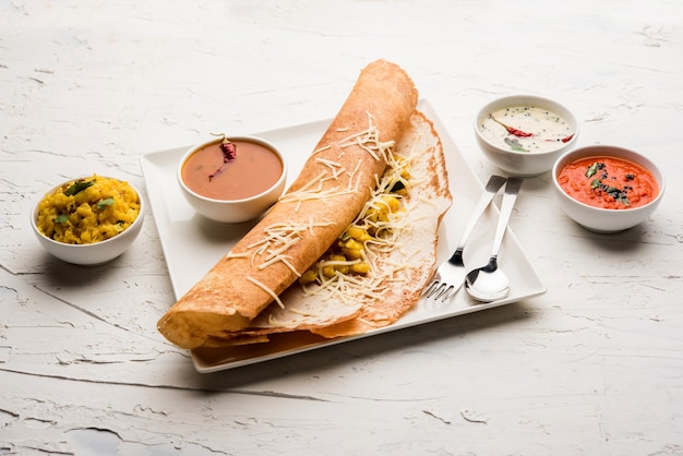 Cheese masala dosa recipe with sambar and chutney, selective focus