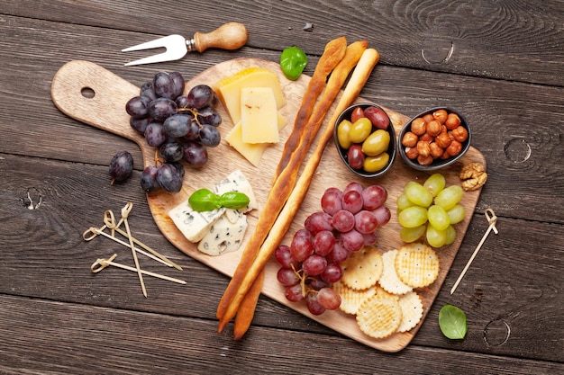 Cheese meat grapes and olives antipasto