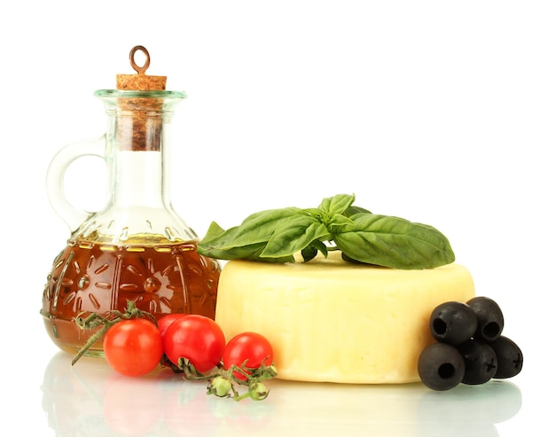 Cheese mozzarella with vegetables and herbs isolated on white