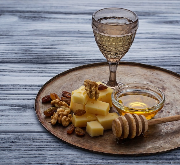 Cheese, nuts, honey and white wine 