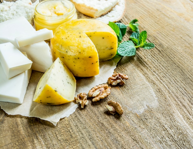 cheese and nuts on wooden table