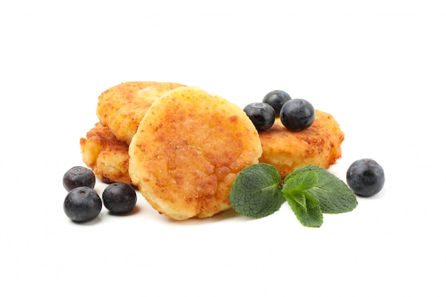 Cheese pancakes, blueberry and mint isolated on white surface