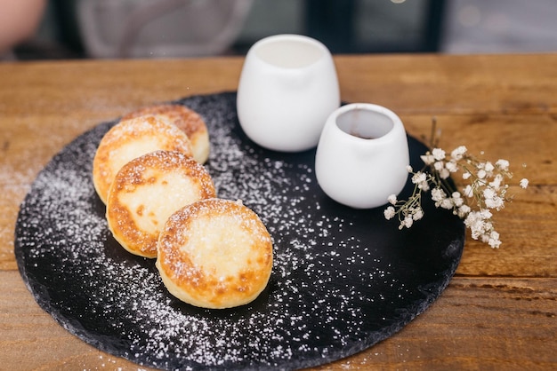 Cheese pancakes homemade traditional Ukrainian and Russian matches selective focus Cheesecakes on a plate