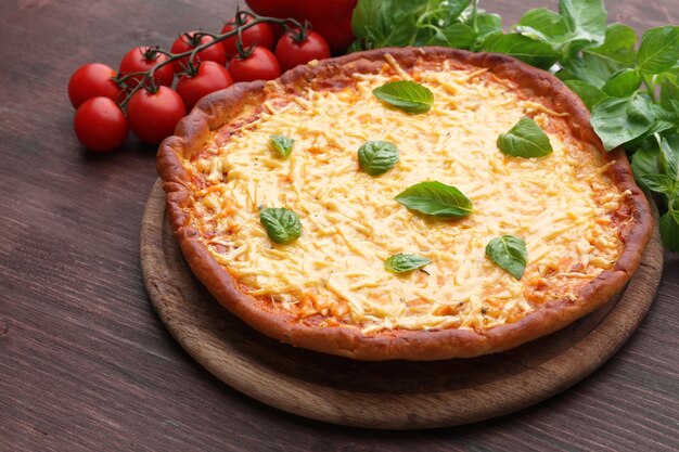 Cheese pizza with vegetables on table close up