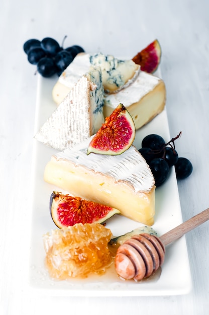 Cheese plate Assortment of various types   and honey