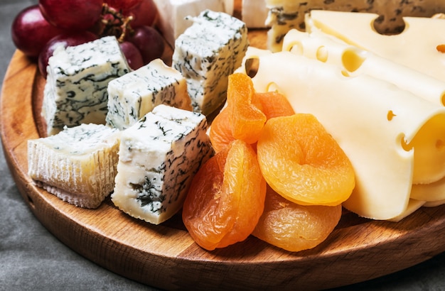 Cheese plate with fruits and nuts 