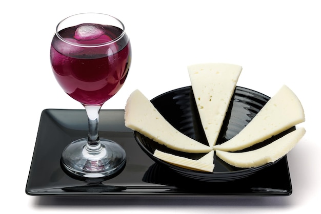 Cheese plate with glass of wine.